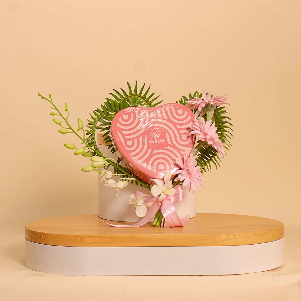 Flowrista Online Flowers Shop Gerbera and Orchid Touch | Patchi Heart Box 22 pcs